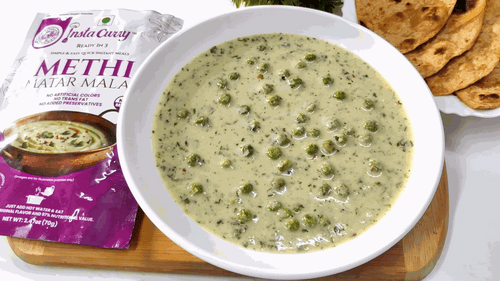 Methi Matar Malai creamy pale green curry with fenugreek leaves and green peas, served with flatbreads