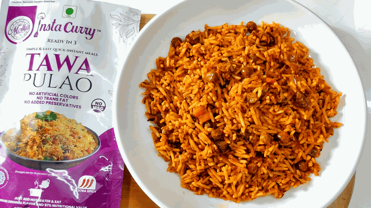 Tawa Pulao & Dal Makhani instant meal bundle with a purple Tawa Pulao pouch and orange seasoned rice on a plate