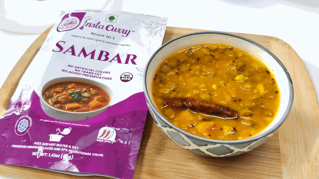 Tawa Pulao meal assortment featuring a purple Insta Curry Sambar pouch beside a bowl of golden lentil stew